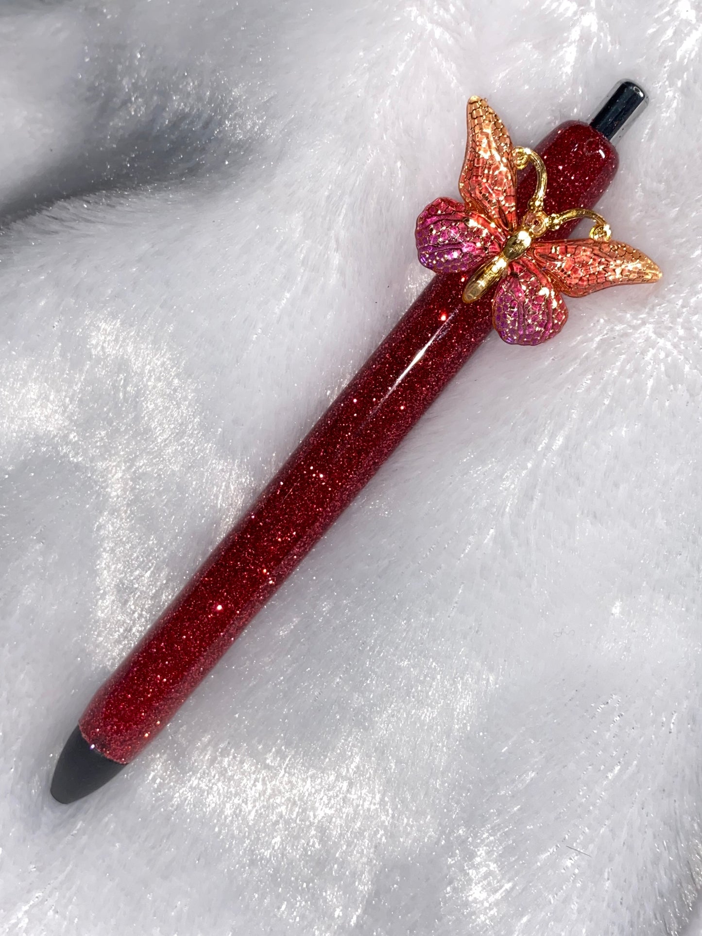 Gel Pen: Burgundy Glitter with a gold/orange/burgundy butterfly charm